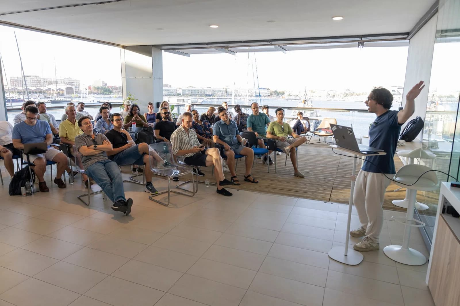 A talk on the terrace at Base 2, the marina behind